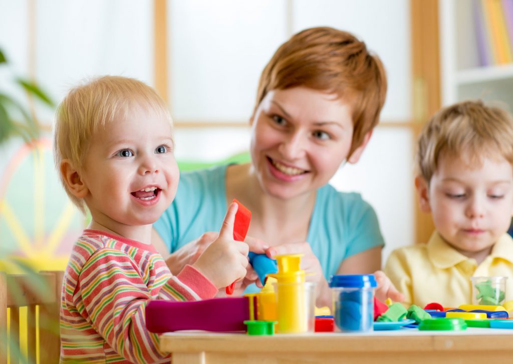 bigstock-woman-playing-and-teaching-wit-79608610
